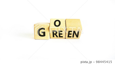 Ecology and go green symbol. Concept words Go green on wooden cubes. Beautiful white table white background. Business ecological and go green concept. Copy space. 98445415