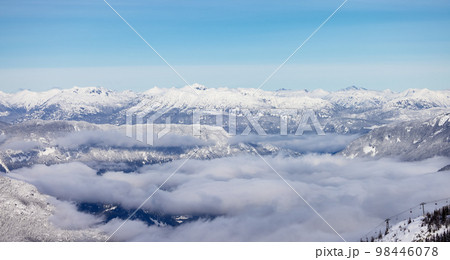 Snow and Cloud covered Canadian Nature Landscape Background. Winter Season in Whistler 98446078