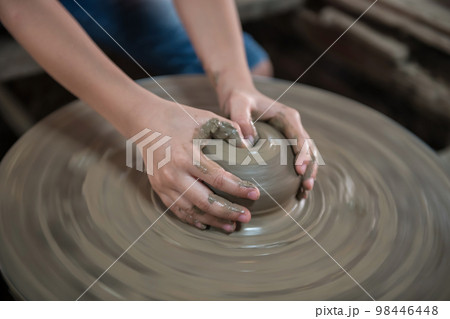 Closeup hands make clay pot to jar or vase in Koh Kret, Nonthaburi Closeup hands make clay pot to jar or vase in Koh Kret, Nonthaburi 98446448