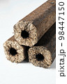 Three wooden pressed briquettes Pini Kay from biomass 98447150
