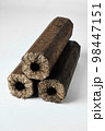 Three wooden pressed briquettes Pini Kay from biomass 98447151