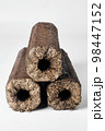 Three wooden pressed briquettes Pini Kay from biomass 98447152