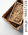 Wooden pellets in two wicker boxes. Biomass fuel 98447158