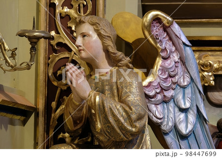 Angel statue on the altar in the church of Saint Matthew in Stitar, Croatia 98447699