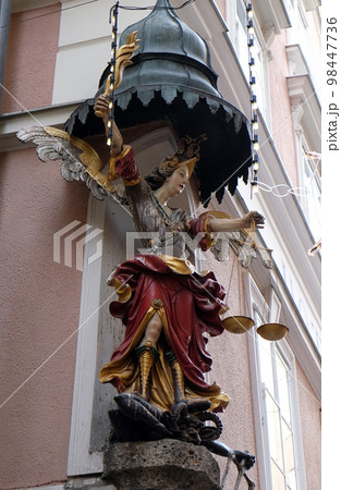 Saint Michael street statue in Salzburg, Austria 98447736
