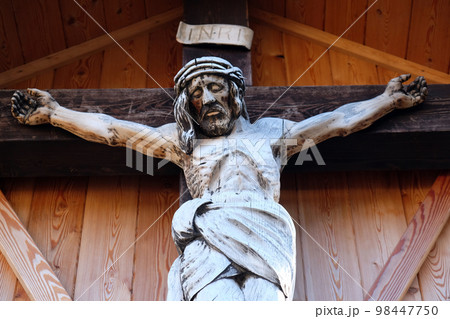 Crucifixion, Cemetery in St. Gilgen on Wolfgang See lake, Austria Crucifixion, Cemetery in St. Gilgen on Wolfgang See lake, Austria 98447750
