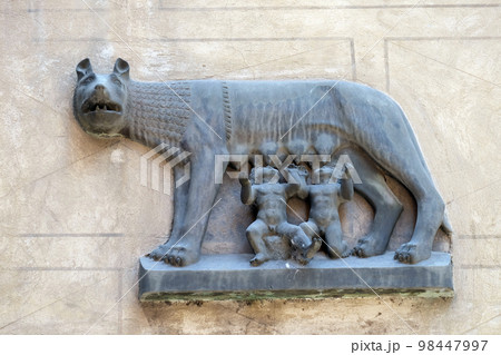 Replica of Capitoline Wolf (Lupa Capitolina) depicting a she-wolf suckling twin human infants, Romulus and Remus, the legendary founders of Rome, bass-relief in Verona Replica of Capitoline Wolf (Lupa Capitolina) depicting a she-wolf suckling twin human infants, Romulus and Remus, the legendary founders of Rome, bass-relief in Verona 98447997