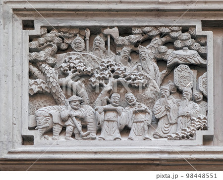 Richly carved stone bass-relief plaque on the doorway of the house in the Grand Canal, ancient town of Yuehe in Jiaxing, Zhejiang Province, China Richly carved stone bass-relief plaque on the doorway of the house in the Grand Canal, ancient town of Yuehe in Jiaxing, Zhejiang Province, China 98448551