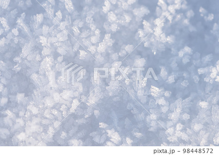 Spring grainy blue snow background, snow as background, closeup view. Winter weather 98448572