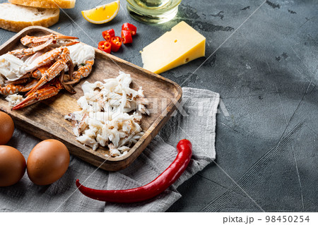 Chilli crab silky omlette ingredients, on gray background , with copyspace and space for text Chilli crab silky omlette ingredients, on gray background , with copyspace and space for text 98450254