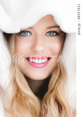 Beautiful woman in white fur coat, beauty and winter fashion. Beautiful woman in white fur coat, beauty and winter fashion. 98457831