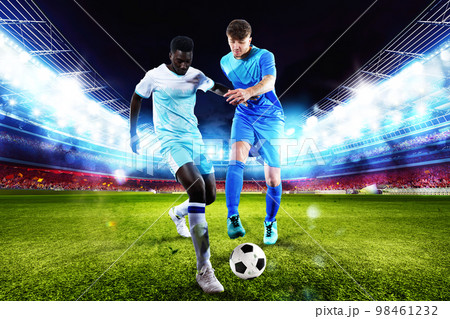 Football action scene with competing soccer players at the stadium 98461232