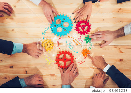 Business team connect pieces of gears like a teamwork and partners 98461233