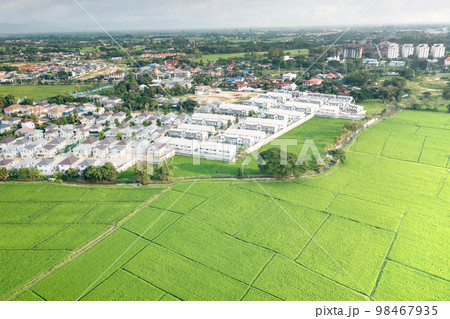Land and housing estate in aerial view. 98467935