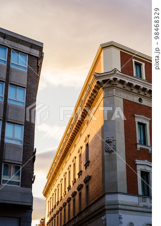 Old residential buildings in central Madrid at sunset 98468329