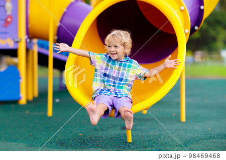 Child on playground. Kids play outdoor. Child on playground. Kids play outdoor. 98469468
