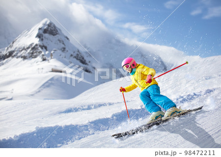 Kids ski. Winter family snow sport. Child skiing 98472211