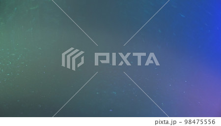 Defocused glow overlay. Light flare. Bokeh radiance. Blur green blue purple color gradient glitter gleam grain texture abstract copy space background. 98475556