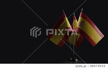 Small national flags of the Spain on a black background Small national flags of the Spain on a black background 98479543