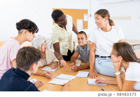Diverse people on language courses in classroom Diverse people on language courses in classroom 98483375