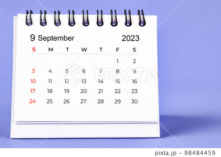 The September 2023 Monthly desk calendar for 2023 year on purple background. 98484459