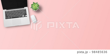 Top view with call center desktop, headset and accessories on pink table background. Top view with call center desktop, headset and accessories on pink table background. 98485636