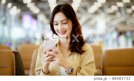 Asian woman waiting for departure at the airport on vacation holiday 98485732