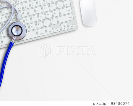 Keyboard with blue stethoscope on white table background.Computer servise and repair concept Keyboard with blue stethoscope on white table background.Computer servise and repair concept 98486074