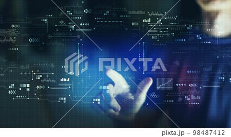 Technology screen with young man in the night 98487412