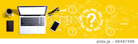 Question marks with a laptop computer 98487496