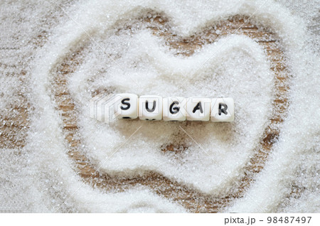 Sugar on table background, white sugar for food and sweets dessert candy heap of sweet sugar crystalline granulated Sugar on table background, white sugar for food and sweets dessert candy heap of sweet sugar crystalline granulated 98487497