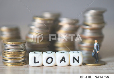 Loan business economy concept of money and finance on table, Loan business finance economy and business man standing on a coin on wooden table background 98487501