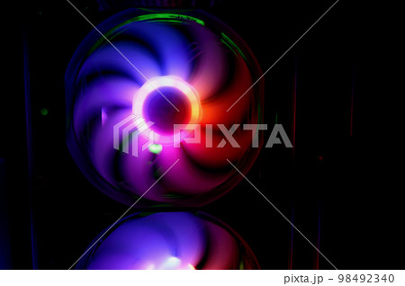 Colorful bright rainbow led rgb pc fan air case cooler. Computer chassis. Gaming modding, technology concept and IT background. 98492340