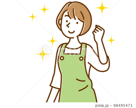 エプロン姿でガッツポーズする若い女性 98495471