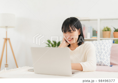 Asian woman happy smile using computer, laptop, Asia women working at home morning 98496377