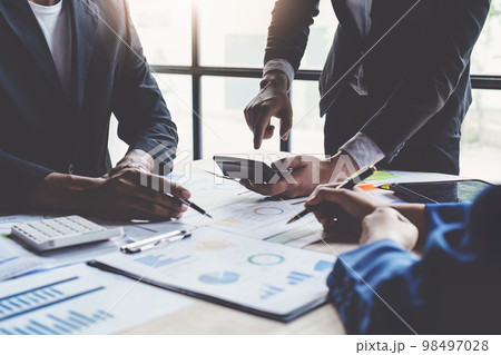 Business financial team with finance reports to analyze big data, balance sheet, account Business financial team with finance reports to analyze big data, balance sheet, account 98497028