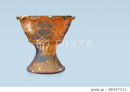 front view antique brown and blue clay pot is placed on a brown and blue clay pedestal on blue background, object, decor, vintage, isolated, banner, copy space 98497521