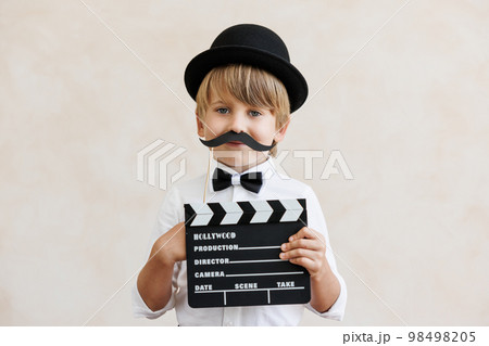 Child pretend to be a director 98498205