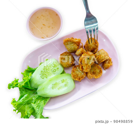 Top view of Deep Fried Crab Meat Rolls with frok, focus selective 98498859