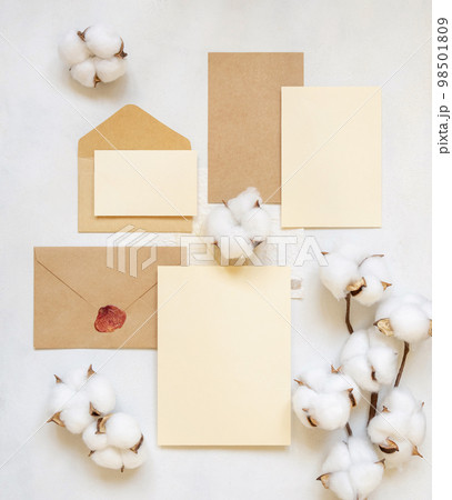 Blank cards and envelope with cotton flowers top view on white, wedding mockup 98501809