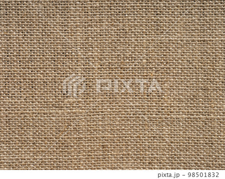 Natural light brown vintage linen canvas fabric texture. Stained, dirty, distressed material for making artwork, painting, designs decoration, background concepts, text, lettering, wall screen saver. 98501832