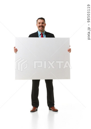 Businessman in a suit holding big empty paper for text, graph over white studio background. Concept of business, career, innovations, ad 98503119