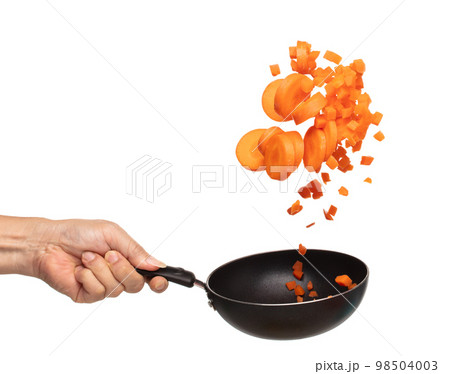 Carrot fresh fly float in Air turn to Cube dice mix with slice shape. Beta Carotene orange color in Carrot is good health. Many Dice cube carrot flying throw up in Air by cooking pan. White background Carrot fresh fly float in Air turn to Cube dice mix with slice shape. Beta Carotene orange color in Carrot is good health. Many Dice cube carrot flying throw up in Air by cooking pan. White background 98504003
