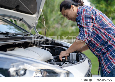 Open hood mechanic engine system to check and repair damage car crash. 98505755
