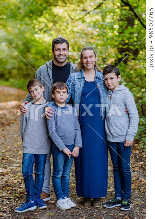Portrait of happy family with kids in a forest. Portrait of happy family with kids in a forest. 98507765