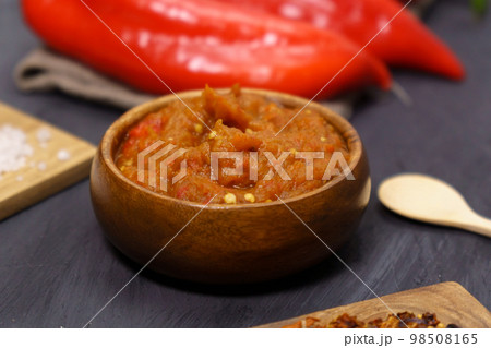 Balkan sauce ajvar and ingredients for its preparation. Serbian traditional food. Balkan sauce ajvar and ingredients for its preparation. Serbian traditional food. 98508165