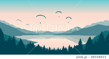 paragliding adventure flying with friends by the lake on mountain background at sunset 98508833