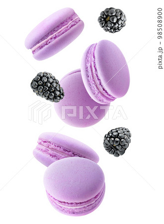 Pink macaroons and blackberries levitating, isolated on white background 98508900