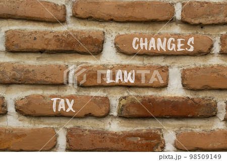 Tax law changes symbol. Concept words Tax law changes on red brown brick wall on a beautiful brick wall background. Business tax law changes concept. Copy space. Tax law changes symbol. Concept words Tax law changes on red brown brick wall on a beautiful brick wall background. Business tax law changes concept. Copy space. 98509149