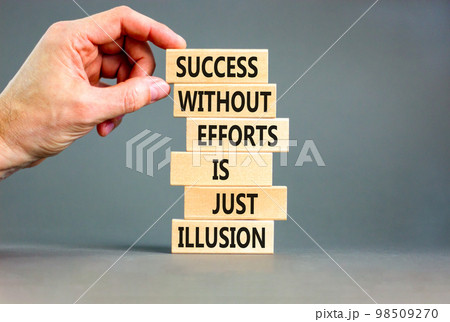 Success symbol. Concept words Success without efforts is just illusion on wooden blocks on a beautiful grey table grey background. Businessman hand. Business success and efforts concept. Success symbol. Concept words Success without efforts is just illusion on wooden blocks on a beautiful grey table grey background. Businessman hand. Business success and efforts concept. 98509270